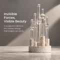 HOMZURE clear sphere and column sculpture on a pale speckled circular base against a plain background