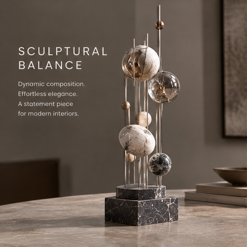 HOMZURE sculptural balance accent showing spheres at varied heights above a veined dark base