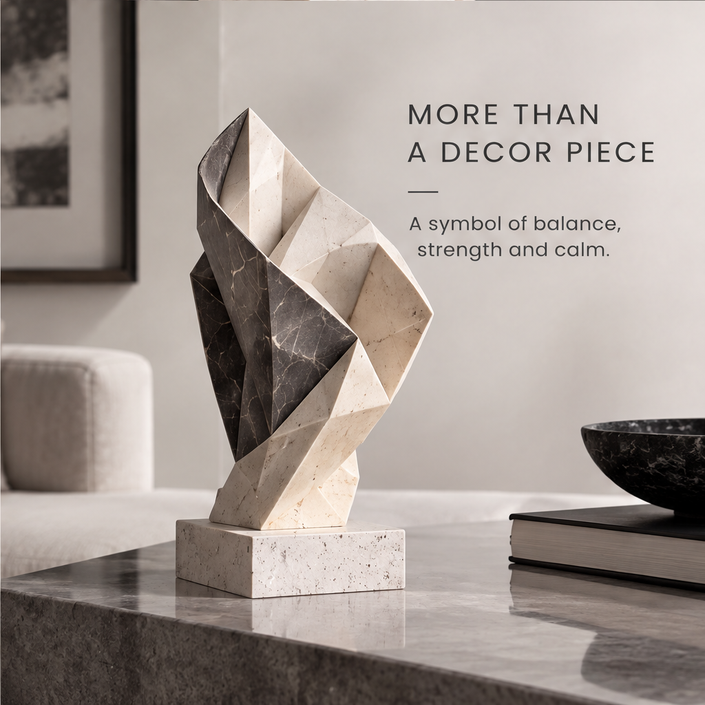 Close-up of HOMZURE sculpture's contrasting dark and pale veined stone-look folds